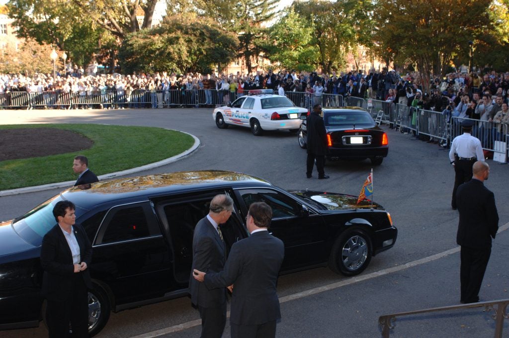 Georgetown President John J. DeGioia escorts King Charles to his vehicle at the end of the event.