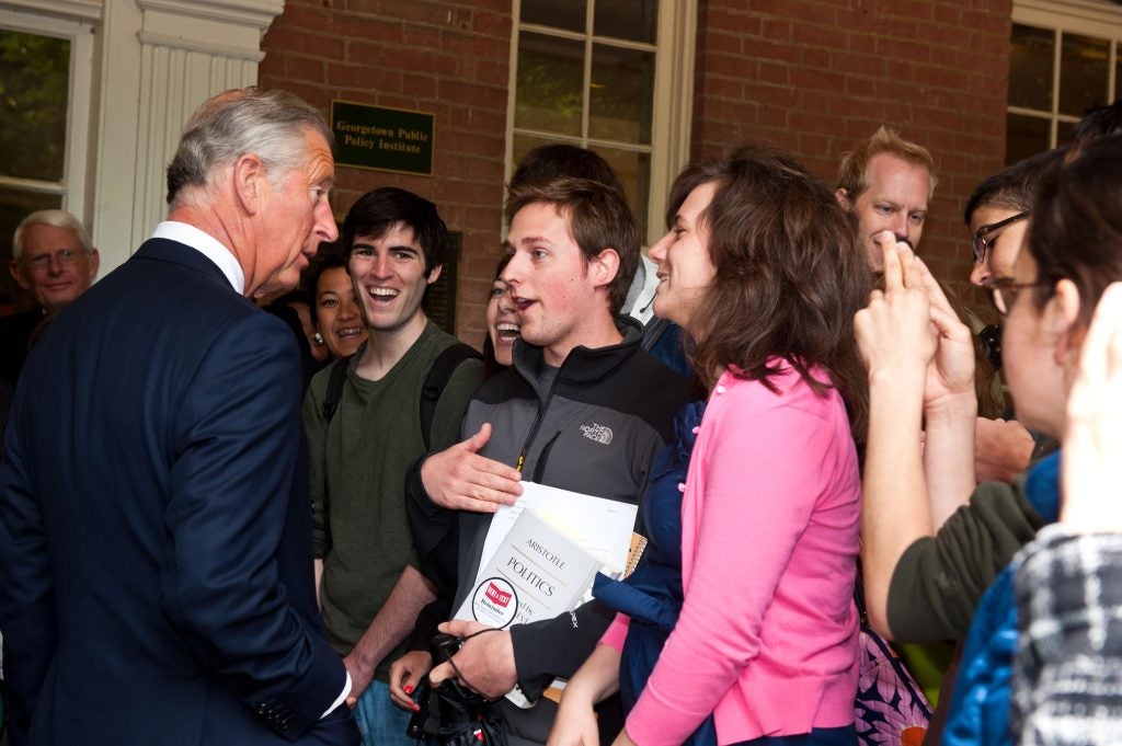 King Charles greets students outside of Old North.