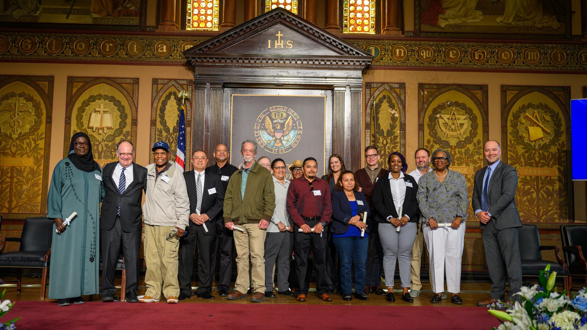 President John J. DeGioia stands with the honorees at the Service Awards Ceremony.