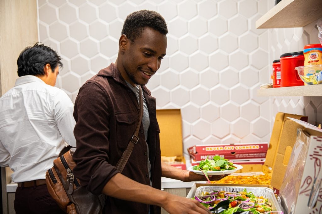 Gandawa grabs a plate of salad at the CALL.