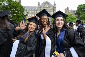 Three graduates posing for a photo