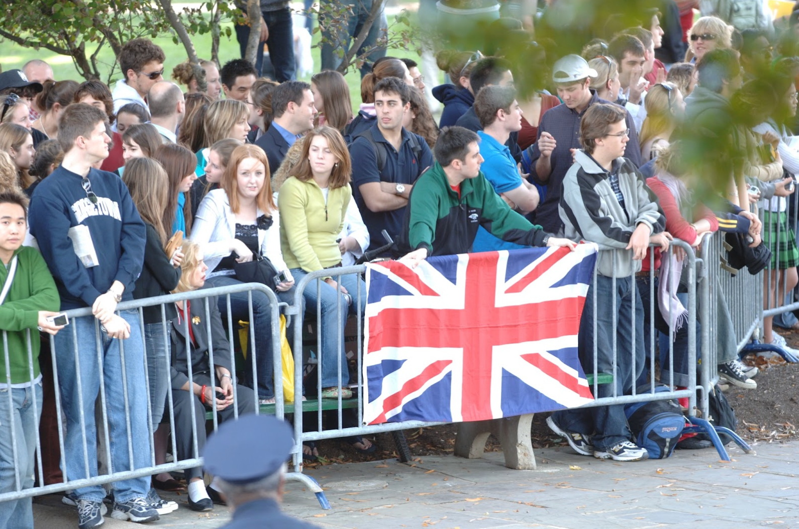 Students wait to meet King Charles behind gates in Healy Circle.