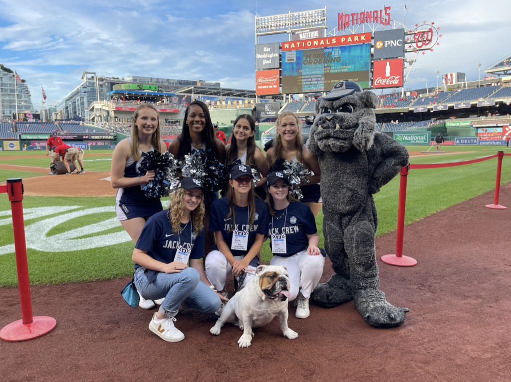 Members of the cheerleading team and Jack Crew pose with Jack the Bulldog and the mascot.