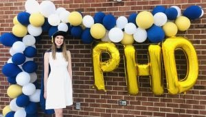 Fitzgerald in her Ph.D. cap with some celebratory balloons.