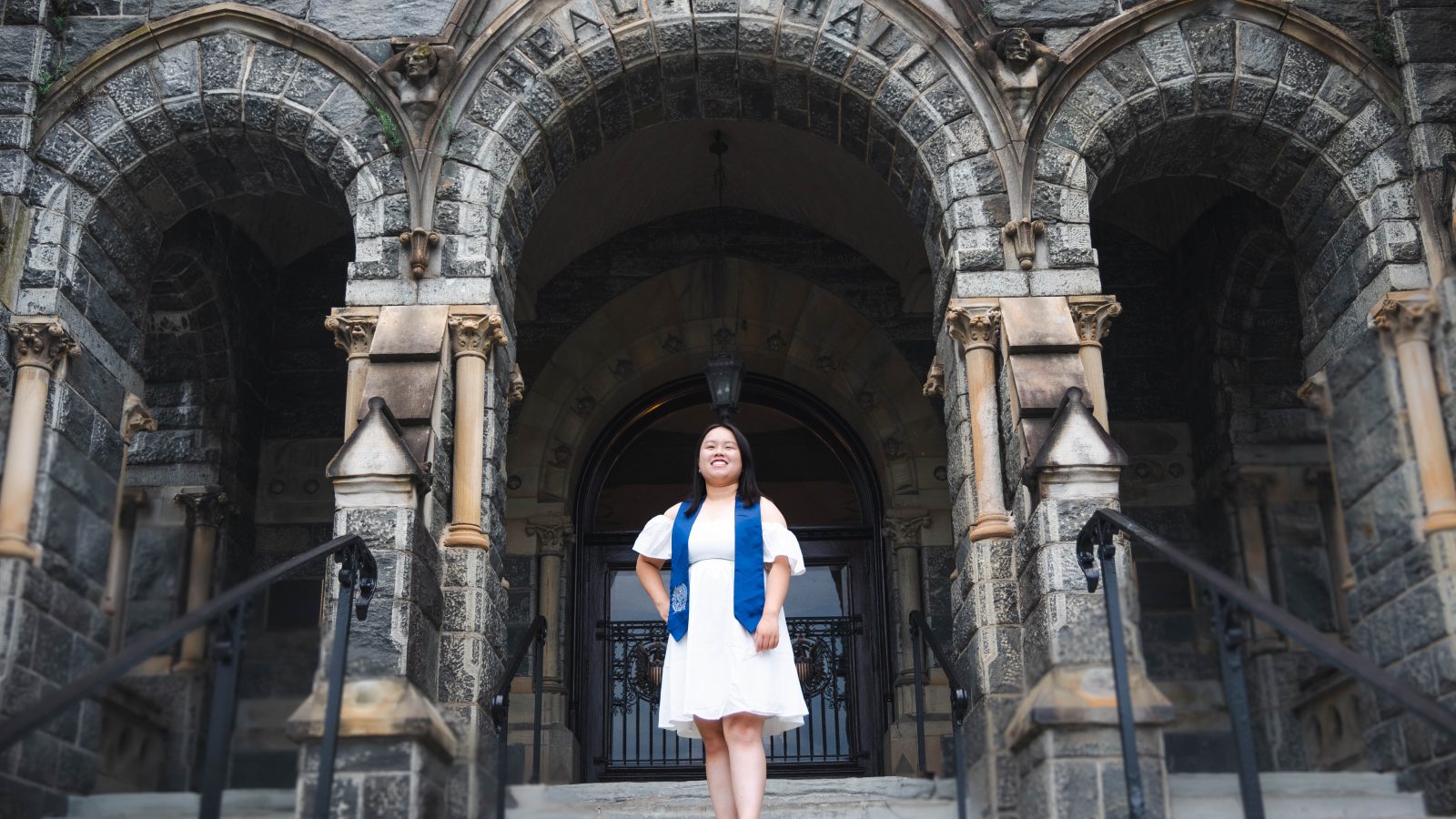 Sofia Chen Ma (B&#039;23) stands on the Healy steps outside Healy Hall in the weeks before her graduation from Georgetown.