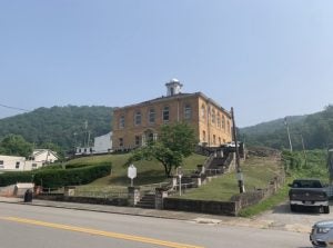 A building stands on a hill on a clear day.