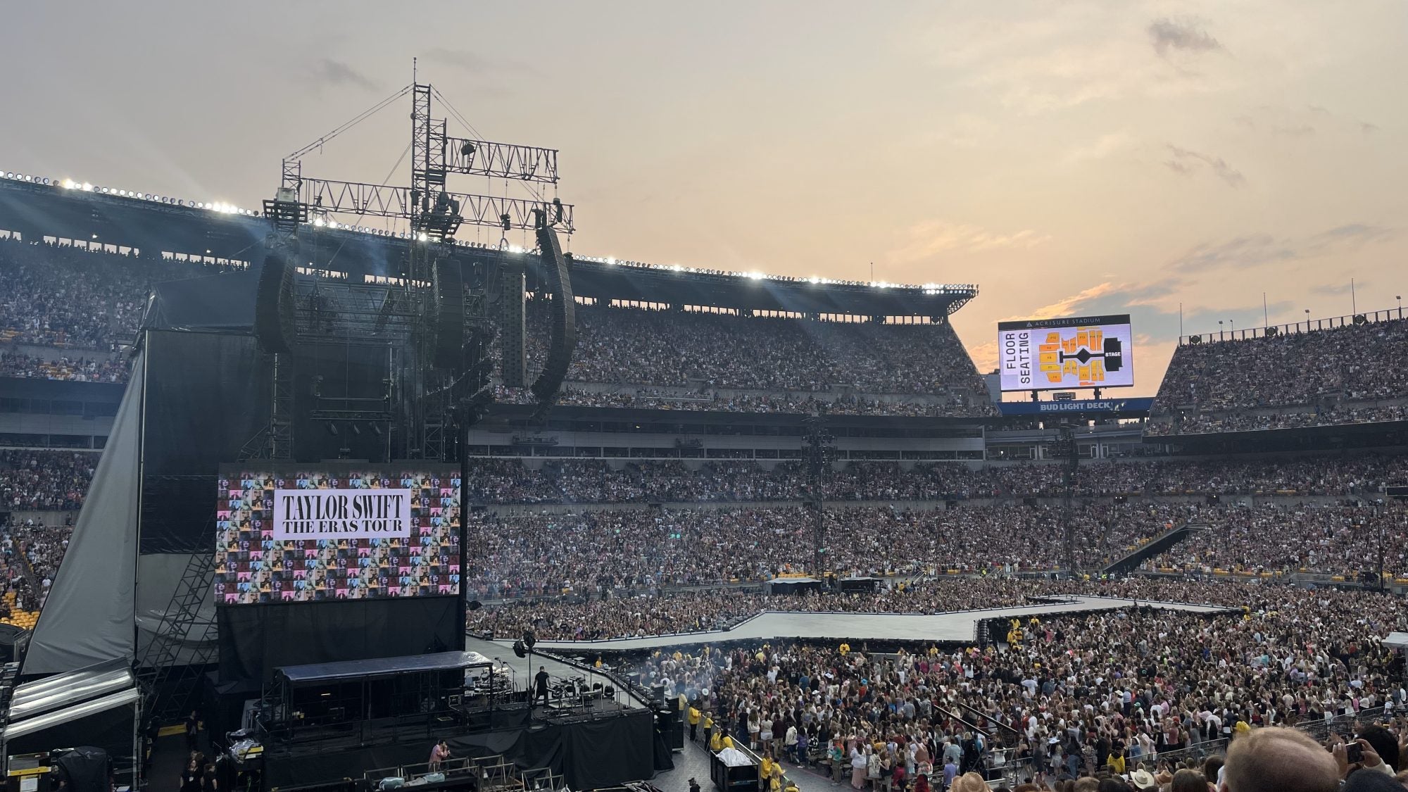 Photo of Eras Tour concert in a packed stadium
