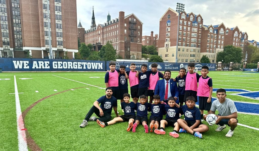 A group of Puede Network Scholars play soccer with Gonzalez (center) at Georgetown in 2023 during a trip to visit him in the White House. 