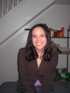 Headshot of a woman in a house