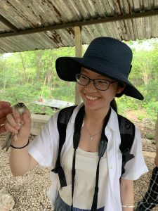 Ava Zhang (SFS’26) holds a bird in her hand.