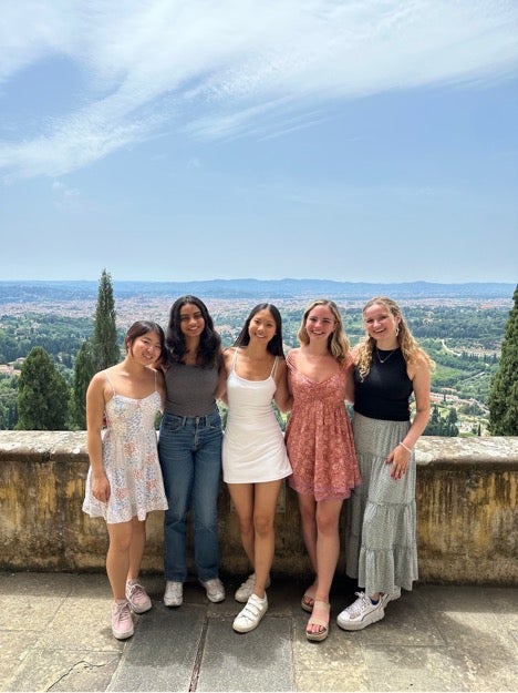 five students stand smiling at Georgetown's Villa Le Balze