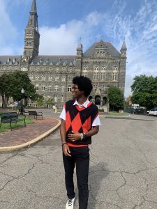 Darius Wagner in front of Healy Hall