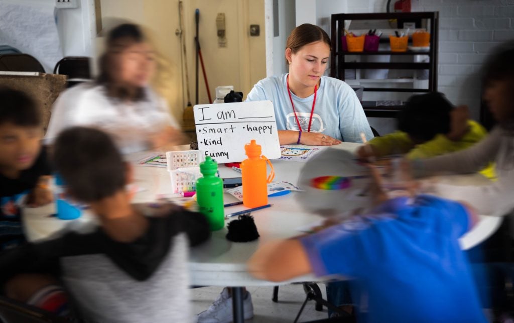 Caroline Vail volunteering in classroom during a camp for migrant children.