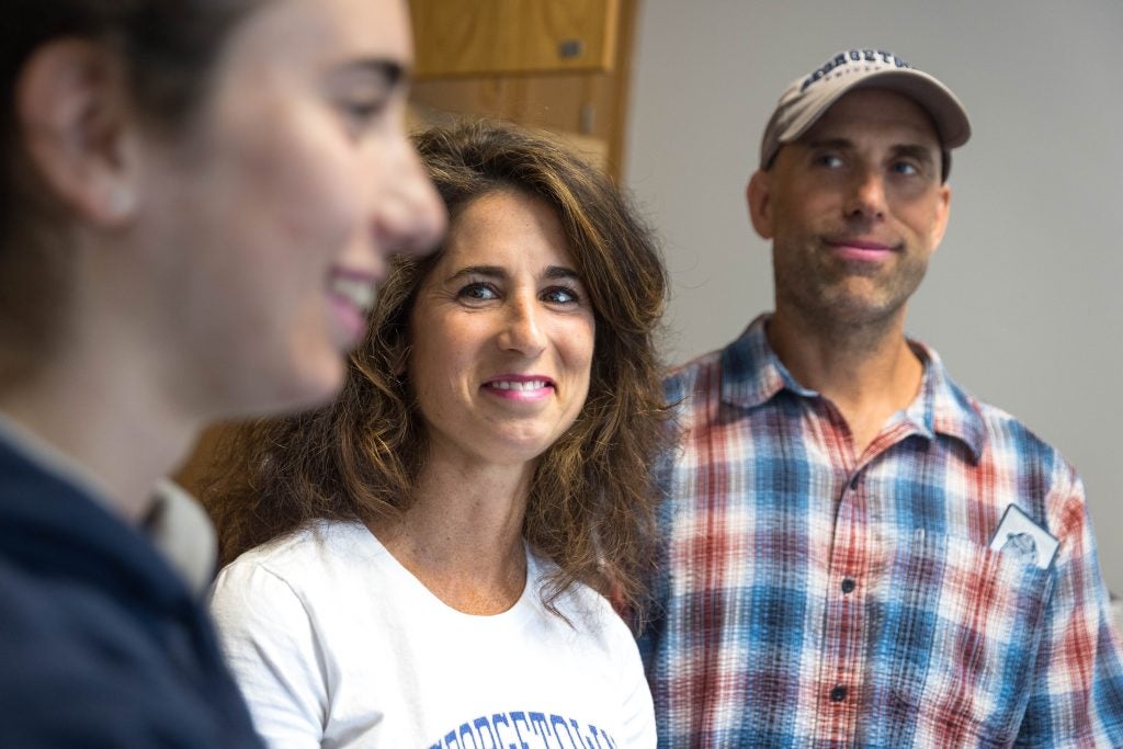 Parents look on at their daughter during move-in 2023 at Georgetown.