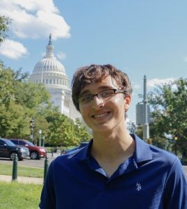 Headshot of Martin Neisuler with the U.S. Capitol in the background.