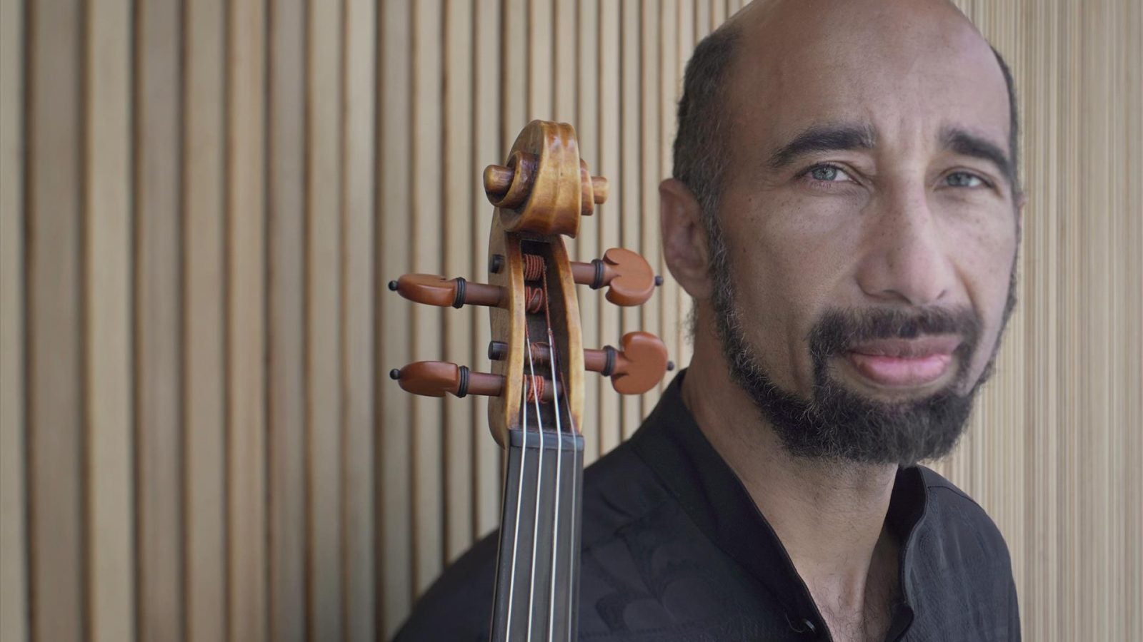 Gregory Walker, posing with instrument.