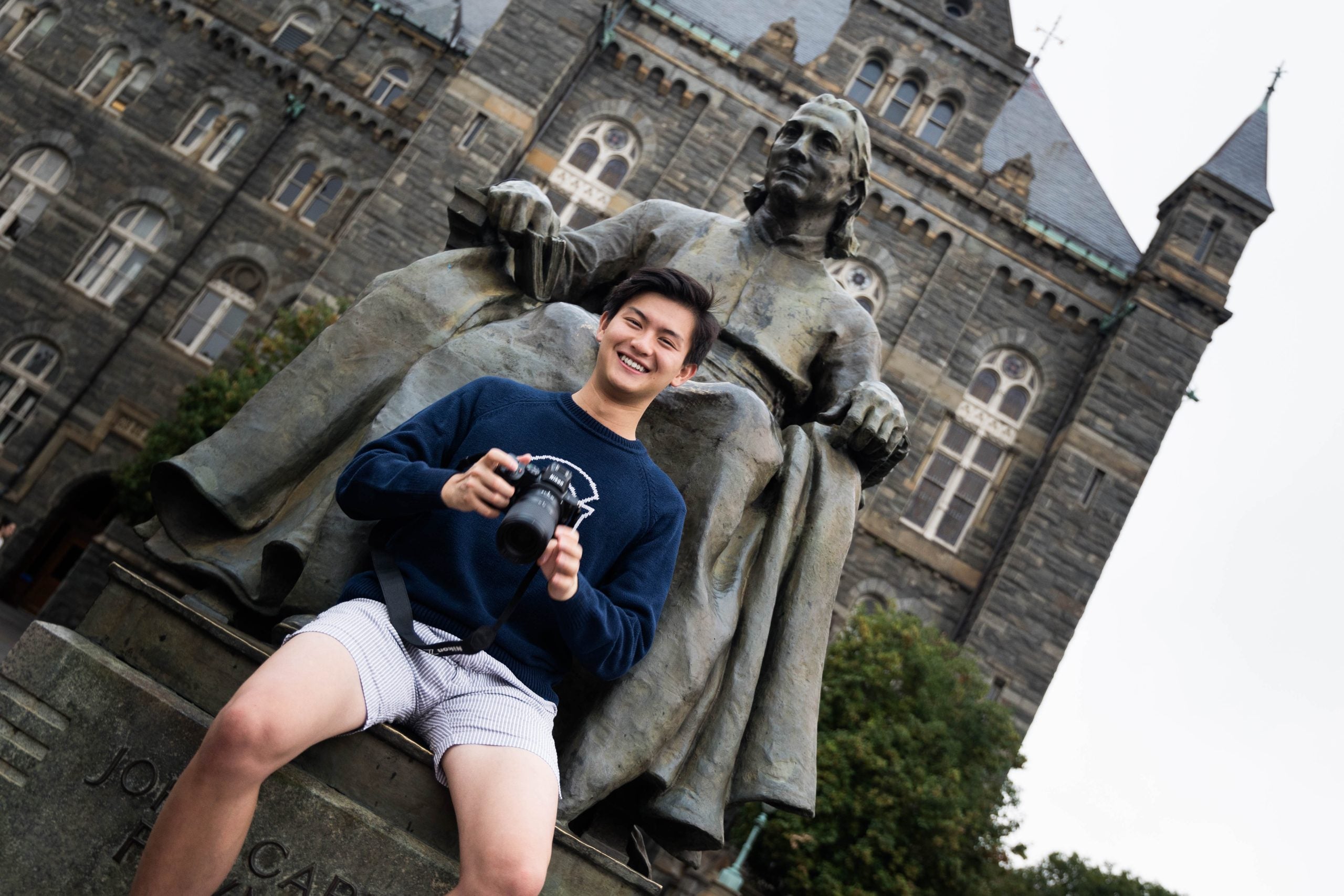 Bennie Chang in front of Healy Hall