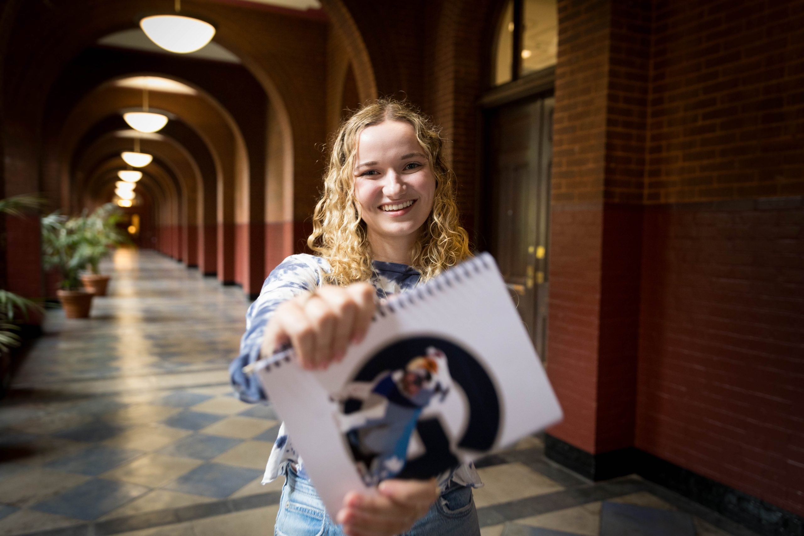 Gracy Hardymon with a Georgetown notebook