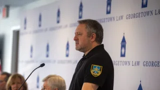 The Prosecutor General of Ukraine, Andriy Kostin, speaks behind a podium at an event at Georgetown Law.