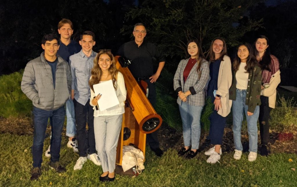 Collins stargazing with a group of students in the Figge Fellows program.