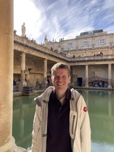 Man in ancient Roman ruins