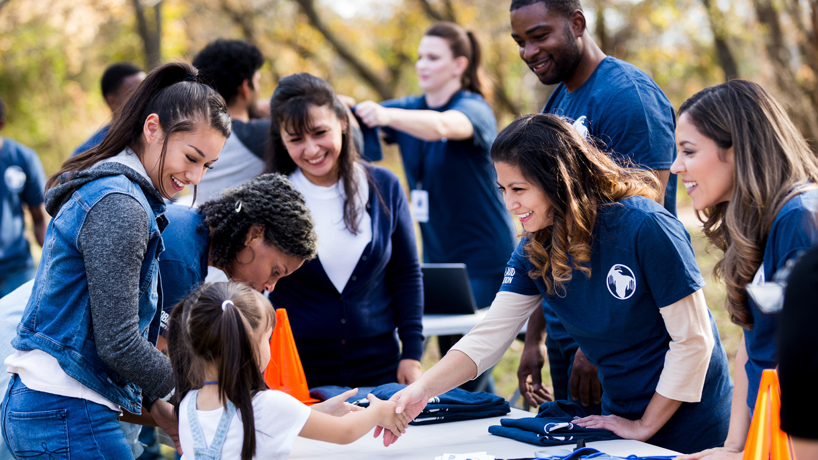 Young adults perform community service outdoors