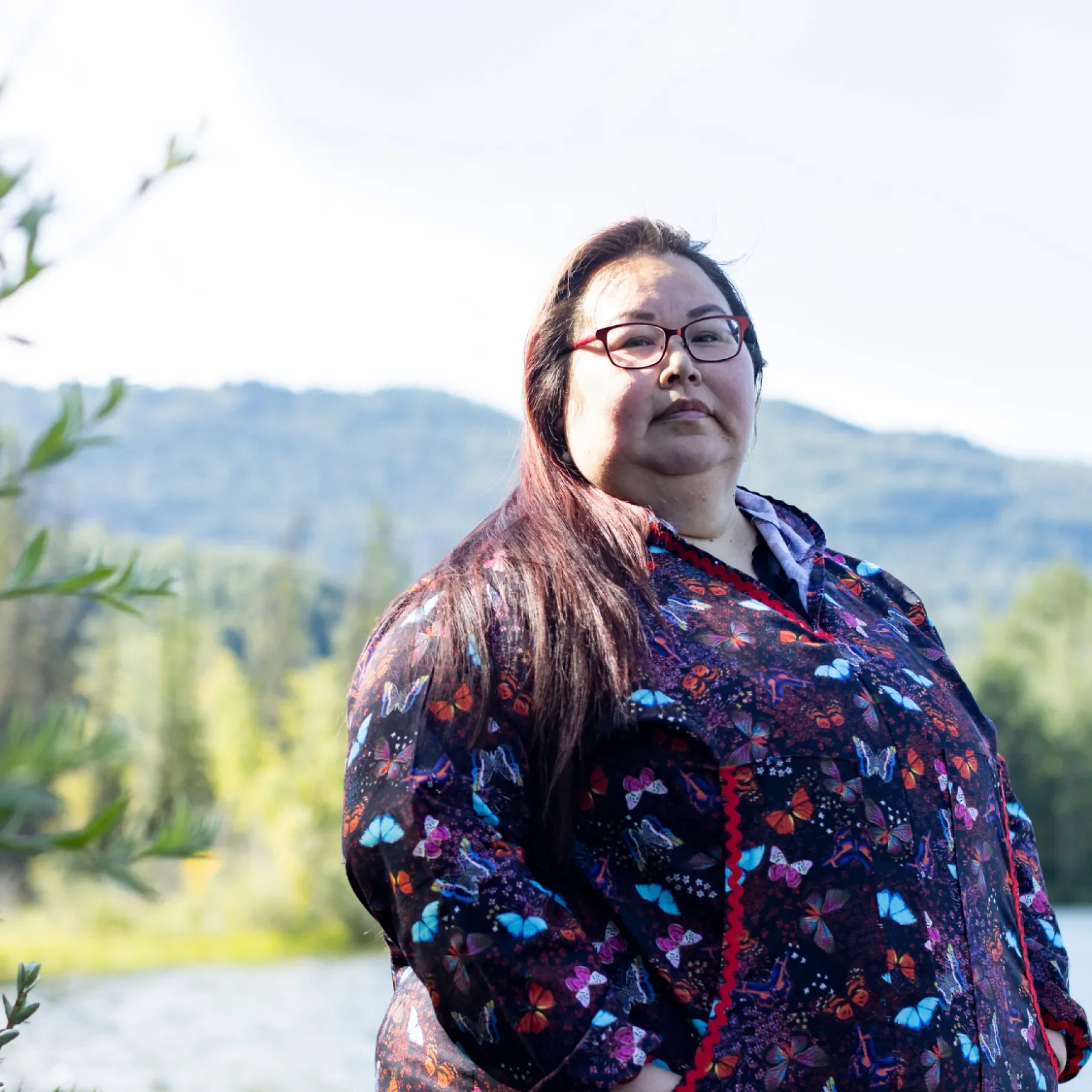 Photo of woman in front of landscape