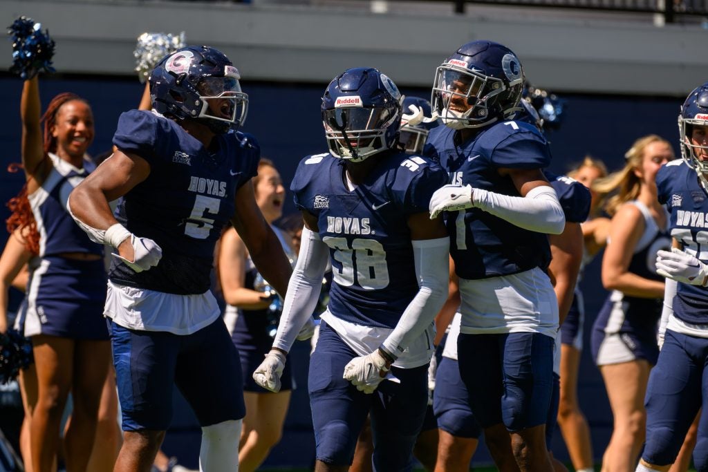 Football players in pads at a game