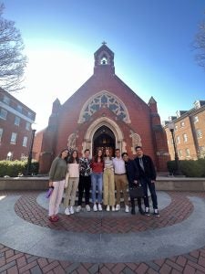 Students standing in front of Dahlgren Chapel.