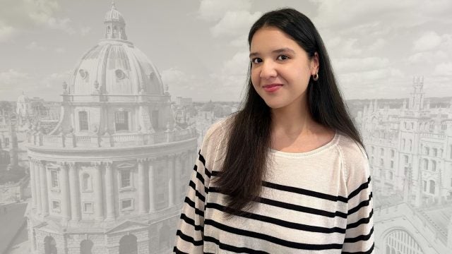 A headshot of Asma Shakeel, a 2024 Rhodes winner, superimposed over a faded background of a building at the University of Oxford.