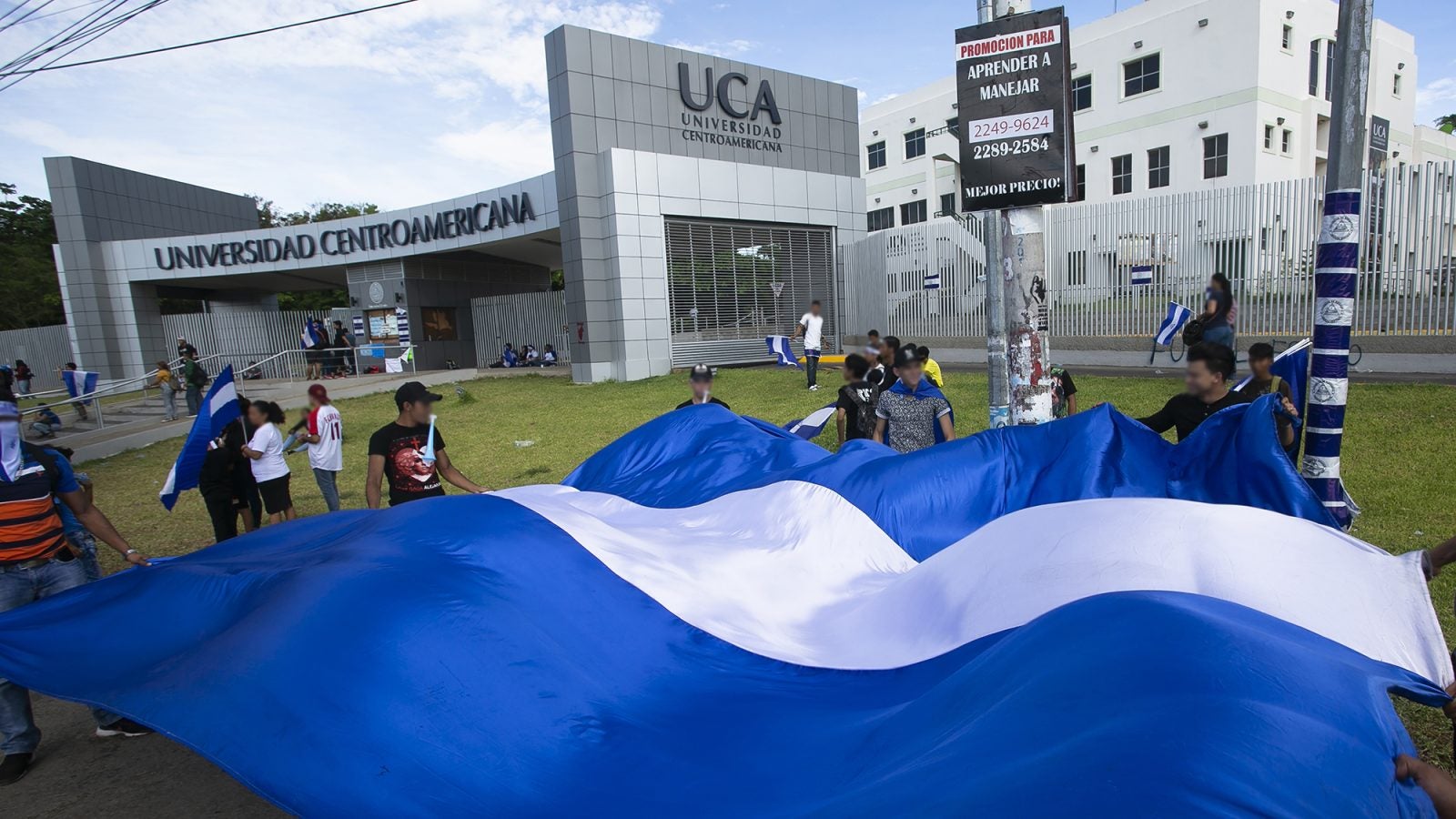 Protestors in front of main entrance to the Universidad Centroamericana in Managua, Nicaragua