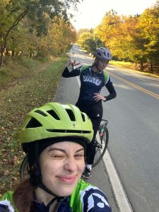 Ava takes a bike selfie on the course with a friend