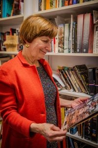 Maureen Corrigan holding a book