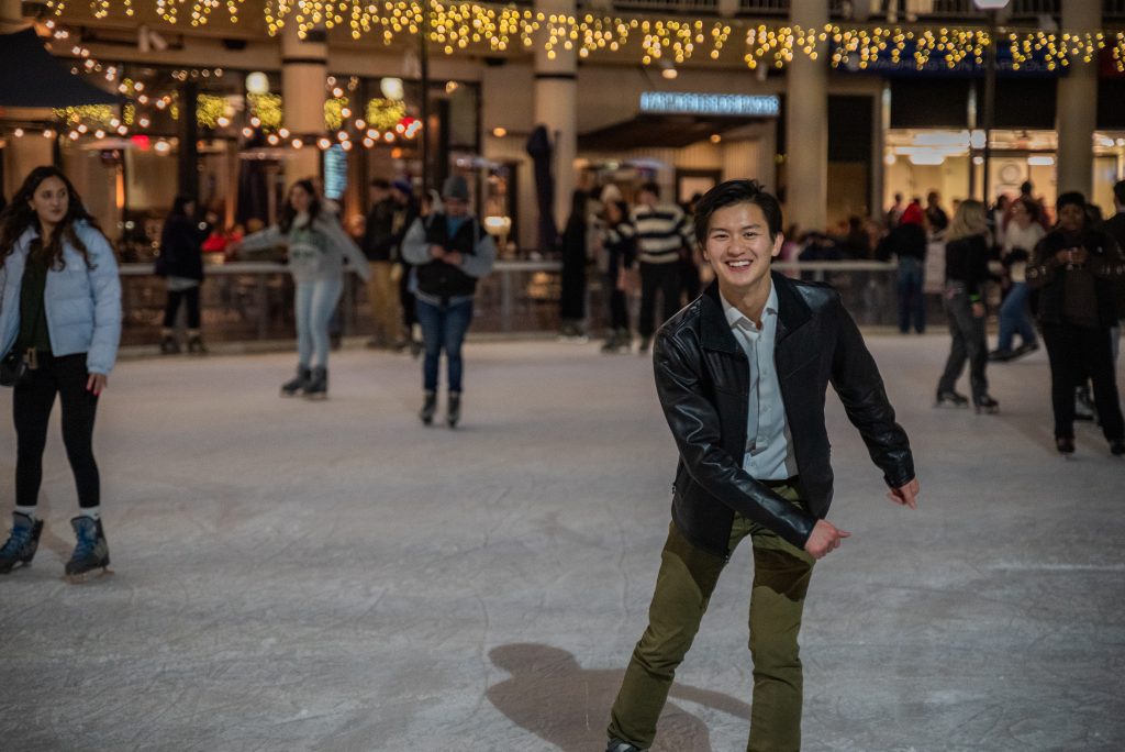 Bennie skates towards the camera on the ice skating rink