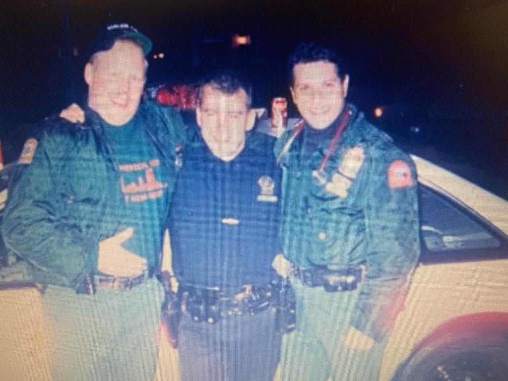 Three firefighters standing together