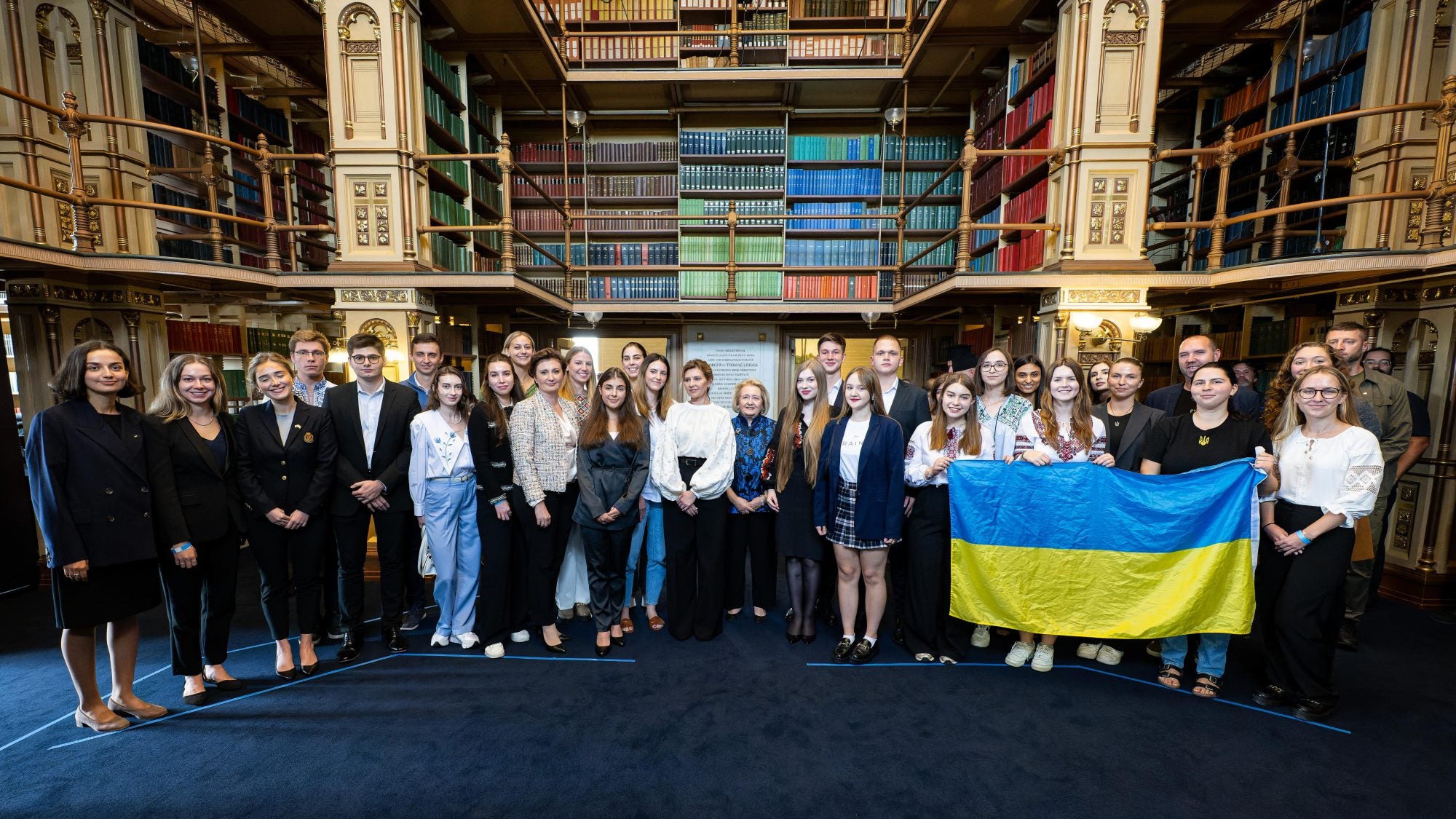 A group of Ukrainian students in Riggs Library with the First Lady of Ukraine