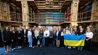 A group of Ukrainian students in Riggs Library with the First Lady of Ukraine