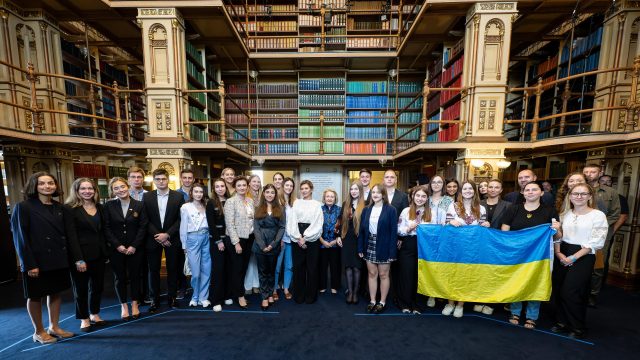 A group of Ukrainian students in Riggs Library with the First Lady of Ukraine