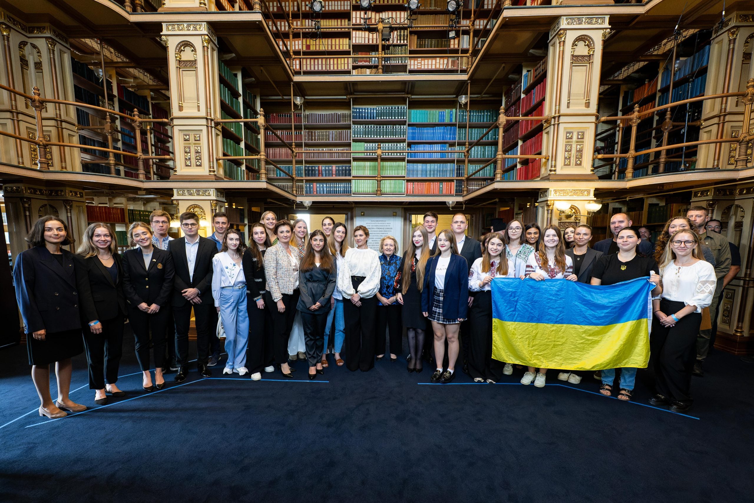 A group of Ukrainian students in Riggs Library with the First Lady of Ukraine