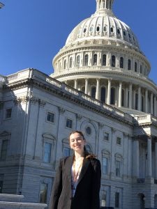 Karyna Stepanovych in business attire in front of the U.S. Capitol