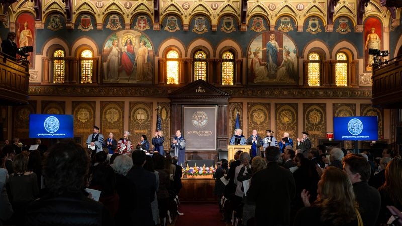 A photo of the stage in Gaston Hall from the audience.