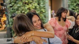 A woman hugs another with a big smile on her face during Georgetown&#039;s Match Day.