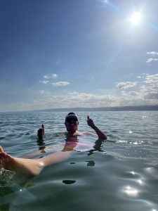 Young man floating in the Dead Sea