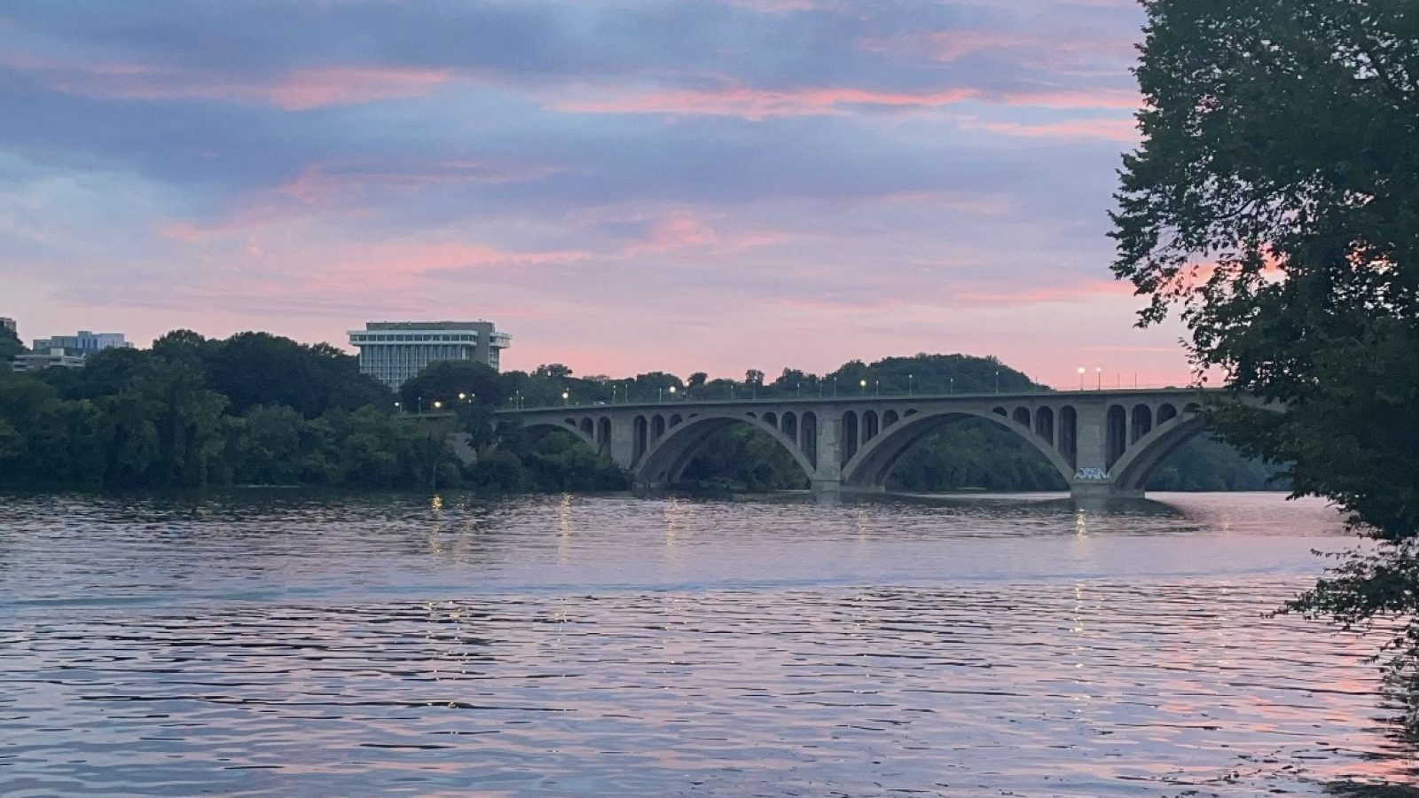 View of Potomac River and Key Bridge during a pink and purple sunset