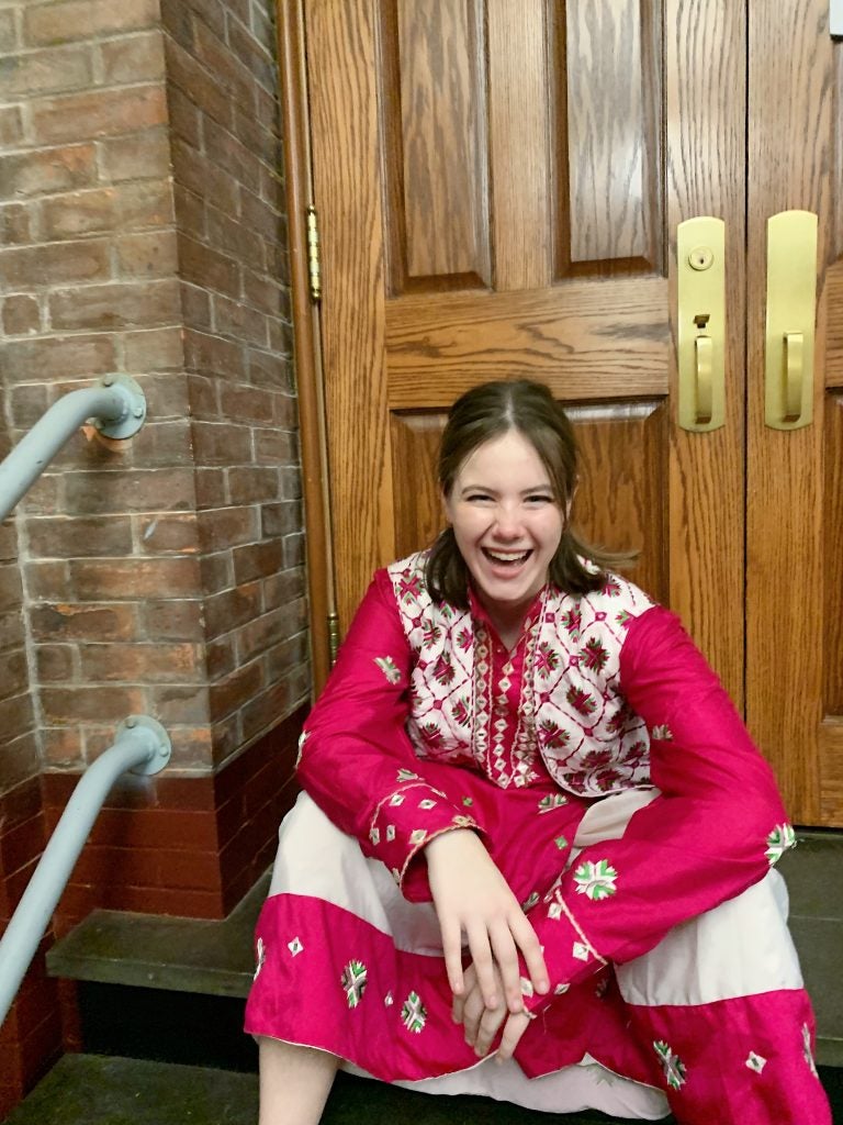 Young white woman in a bright pink garment