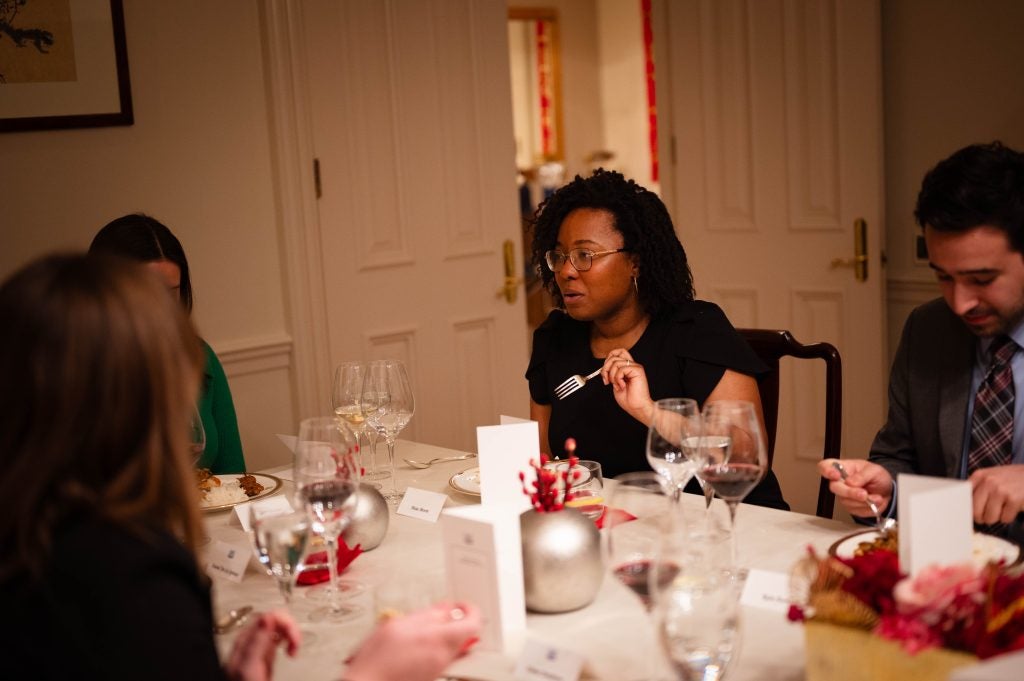 Woman eating dinner at a formal event
