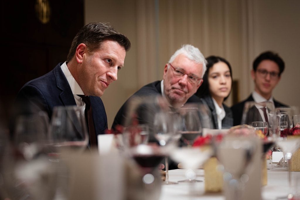 A man looking intently across the table