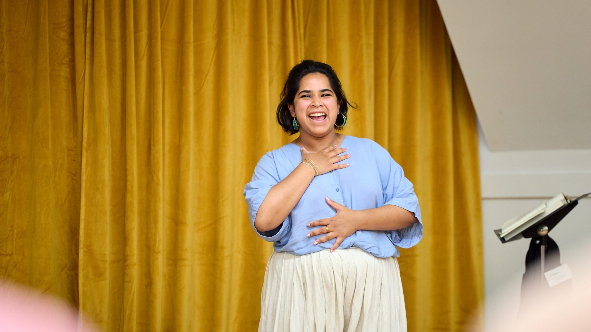 Devika Ranjana smiling indoors