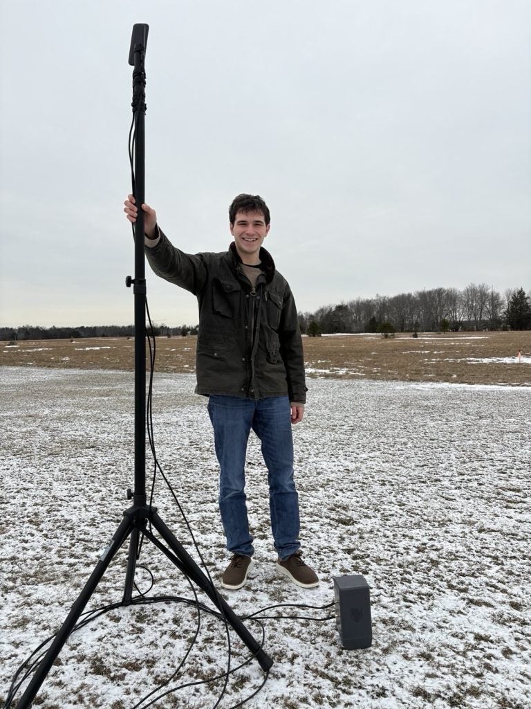 Lucas Raskin outside in the snow while with equipment