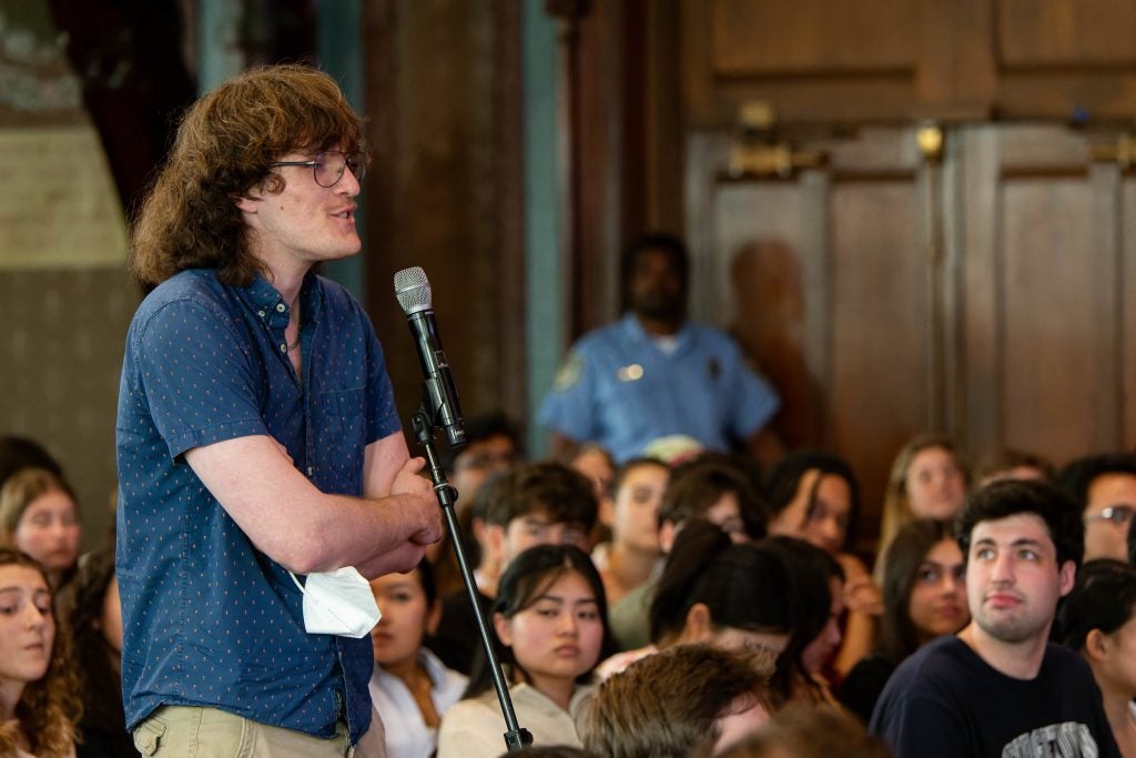 Labranche speaks at a microphone